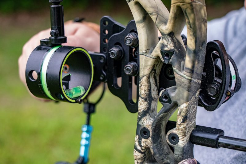 Colorado hunter focusing on the bow sight on his compound bow