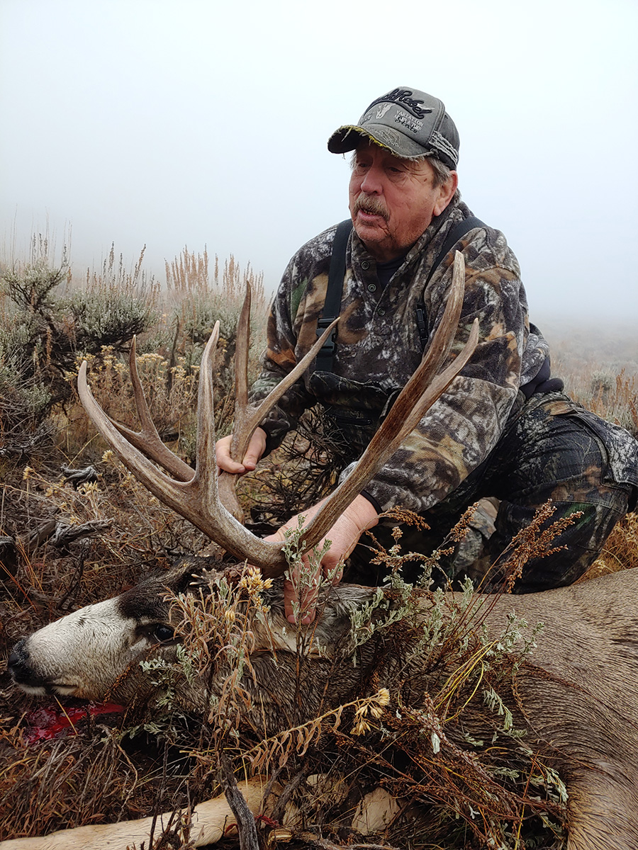Hunter showing his Mule Deer kill