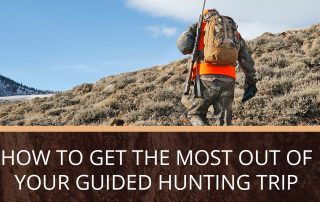 A person in cameo and neon orange on a hunting trip in Southwest Colorado.