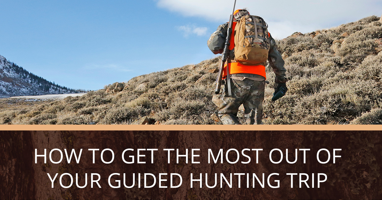 A person in cameo and neon orange on a hunting trip in Southwest Colorado.