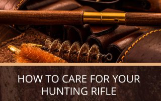 A hunting rifle sitting on a table with cleaning supplies.