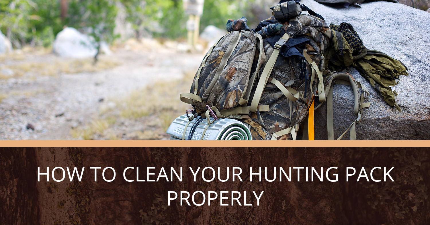 A hunting pack propped up against a rock.